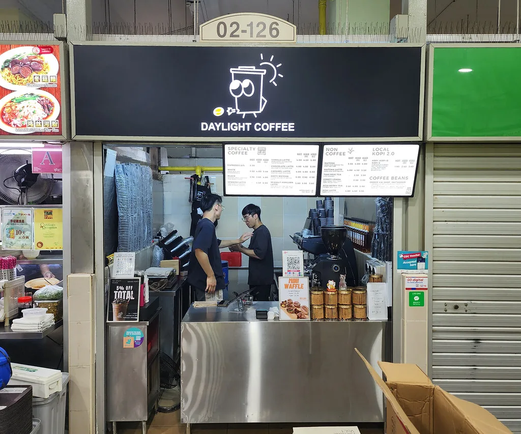 The Daylight Coffee stall at Amoy Street Food Centre, signboard up and two of us behind the counter